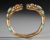A SINO TIBETAN GILDED BANGLE, 19TH CENTURY