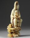 A Chinese soapstone Guanyin figure on stand