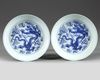 A MATCHED PAIR OF CHINESE BLUE AND WHITE 'DRAGON' DISHES
