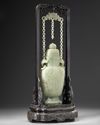 A Chinese pale celadon jade vase and cover