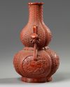 A Chinese imitation-cinnabar-lacquer double gourd vase