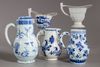 A GROUP OF FIVE CHINESE BLUE AND WHITE AND EN GRISAILLE POURING VESSELS