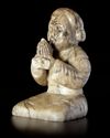 A CREAMY WHITE JADE OF A SHENG-PLAYING MUSICIAN, CHINA, HAN DYNASTY (206 BC-220 AD)