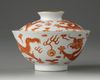 A Chinese white-ground sgraffiato iron-red-decorated 'dragon' bowl and cover