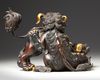 A PARCEL GILT CHINESE BUDDHIST LION FORM CENSER, 20TH CENTURY