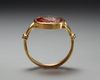 A RENAISSANCE CARNELIAN INTAGLIO PORTRAIT OF THE EMPEROR HADRIAN IN A MODERN GOLD RING, CIRCA 17TH CENTURY A.D.