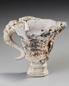A CHINESE BISCUIT PORCELAIN BEAKER, 17TH CENTURY