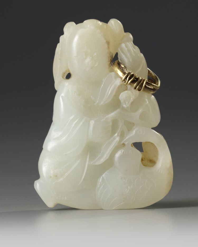A Chinese pale celadon jade 'boy and crane' carving