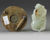 A Chinese celadon jade pommel and a pale celadon jade monkey