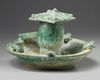 A Chinese green-glazed pottery frog pond