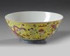 A Chinese yellow ground famille rose 'dragon and phoenix' bowl