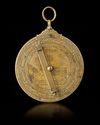 A BRASS ASTROLABE SIGNED BY MUḤAMMAD IBN FATTŪḤ AL-KHAMĀ’IRĪ, SEVILLE (SPAIN), DATED 625 AH / 1227–28 AD