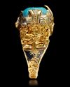 A TURQUOISE SEAL GOLD RING