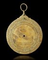 A BRASS ASTROLABE SIGNED BY MUḤAMMAD IBN FATTŪḤ AL-KHAMĀ’IRĪ, SEVILLE (SPAIN), DATED 625 AH / 1227–28 AD