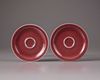 A pair of Chinese copper-red-glazed saucers