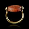 A PHOENICIO - RING WITH A CARNELIAN SCARABOID, 7TH-8TH CENTURY BC