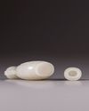A small Chinese white jade flattened baluster vase and cover