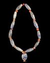 A BLUE GLASS AND CARNELIAN BEAD NECKLACE