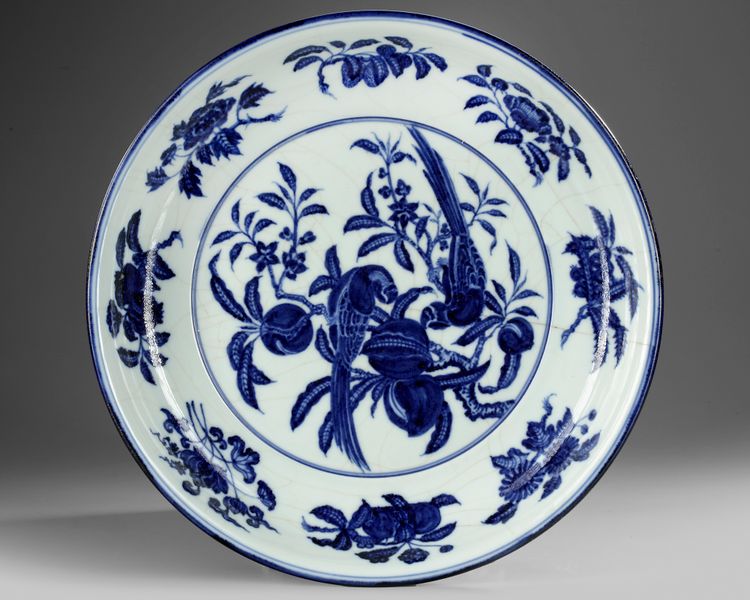 A CHINESE BLUE AND WHITE 'BIRDS' CHARGER, QING DYNASTY (1644–1911)