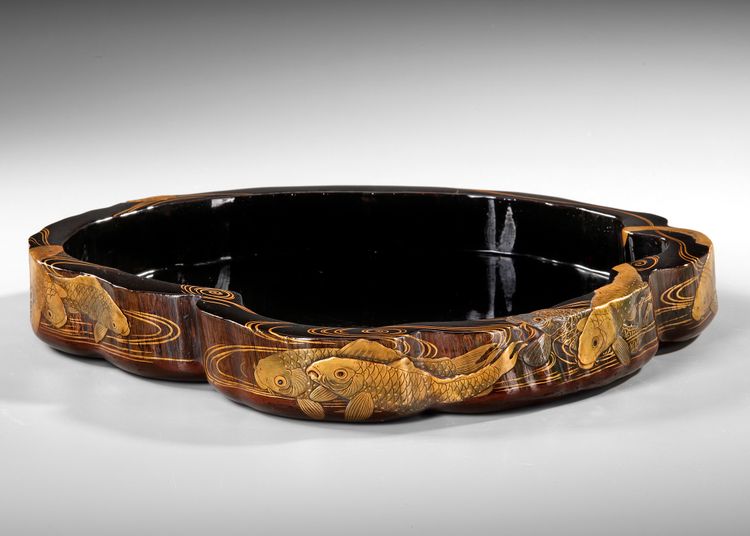 A JAPANESE IRREGULAR SHAPED BLACK LACQUERED WOODEN TRAY,  MEIJI PERIOD (1868-1912)