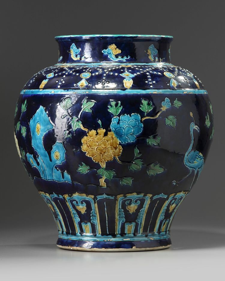 A CHINESE BLUE-GROUND FAHUA WINE JAR, CHINA, MING DYNASTY (1368-1644) OR LATER