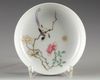 A Chinese famille rose 'bird and flower' saucer