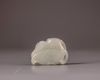 A Chinese pale celadon jade 'cat and dragonfly' carving