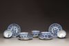 Five blue and white porcelain cups and saucers