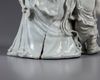 An exceptional large dehua glazed figure of Guanyin with child