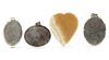A GROUP OF THREE CARNELION MEDALLIONS AND AN AGATE HEARTSHAPED PLAQUE, PERSIA,18TH-19TH CENTURY