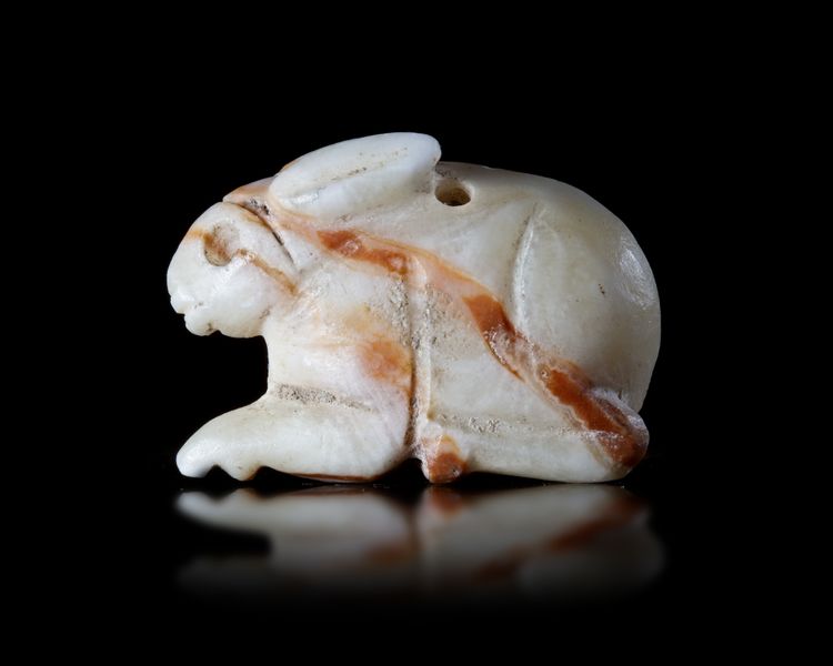 AN EARLY STONE AMULET, POSSIBLY JEMDET NASR OF A HARE, 3RD MILLENIUM BC