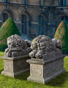A PAIR OF SCULPTED LIMESTONE MODELS OF RECUMBENT LIONS SECOND HALF 20TH CENTURY, AFTER ANTONIO CANOVA (VENETIAN 1757-1822)