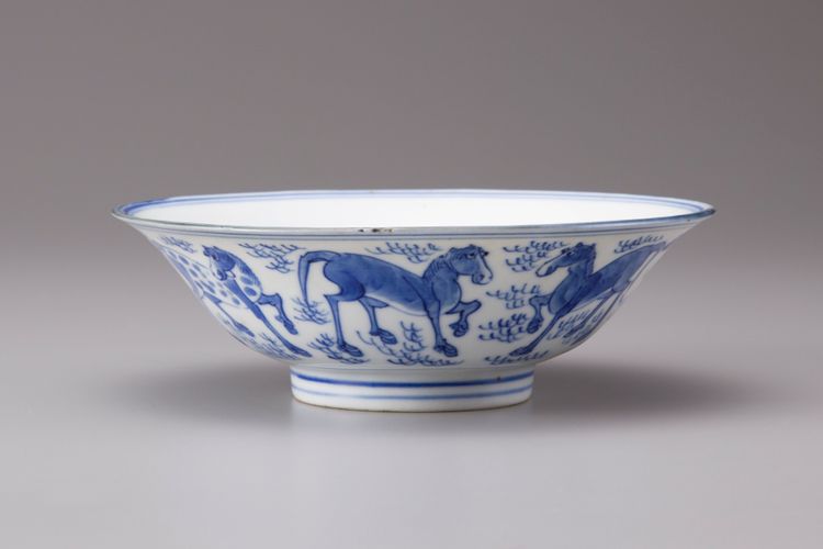 A blue and white conical bowl