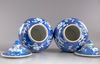 A pair of blue and white Chinese 'cherry blossom' vases and covers