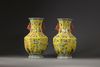 A pair of Chinese yellow-ground appliqué-decorated octagonal vases