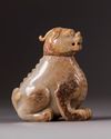 A large Chinese pale celadon and russet qilin vessel and cover