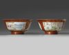 A pair of Chinese coral-ground famille rose 'Tilling and Weaving' bowls