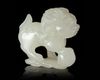 A CHINESE JADE CARVED BUDDHIST LION, 20TH CENTURY
