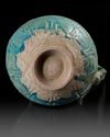 A TURQUOISE GLAZED POTTERY EWER, PROBABLY NISHAPUR, 12TH CENTURY