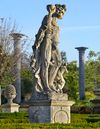 A MONUMENTAL AND IMPRESSIVE ITALIAN SCULPTED LIMESTONE GROUP OF BACCHUS WITH A SATYR,  FIRST QUARTER 20TH CENTURY