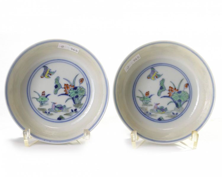 A pair of Chinese doucai 'mandarin duck and lotus' shallow bowls