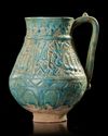 A TURQUOISE GLAZED POTTERY EWER, PROBABLY NISHAPUR, 12TH CENTURY