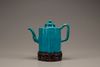 A turquoise-glazed wine pot and cover