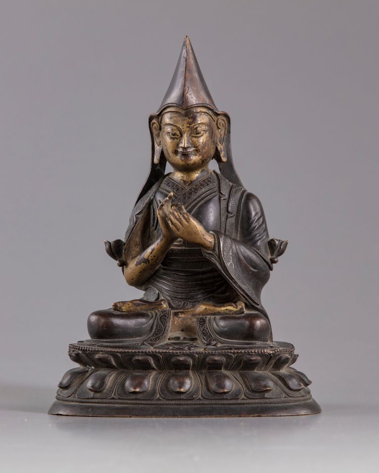 A CHINESE GILT BRONZE FIGURE OF LAMA