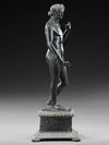 A ROMAN BRONZE STATUETTE OF APOLLO CARNEUS, CIRCA 1ST-2ND CENTURY A.D.