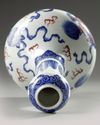 A Chinese copper-red-decorated blue and white garlic-head vase
