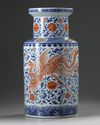 A large Chinese iron-red-decorated blue and white 'dragon and phoenix' rouleau vase