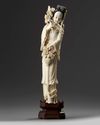 A Chinese ivory carving of a lady holding a flower basket