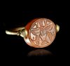 A PHOENICIO - RING WITH A CARNELIAN SCARABOID, 7TH-8TH CENTURY BC
