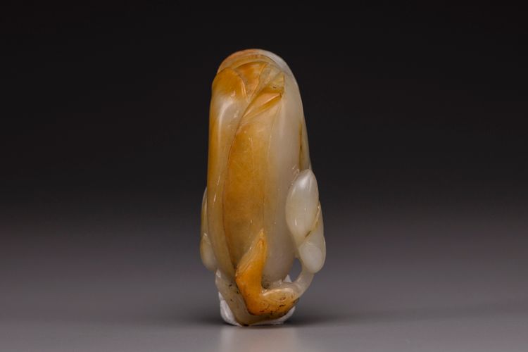 A white and russet jade magnolia carving